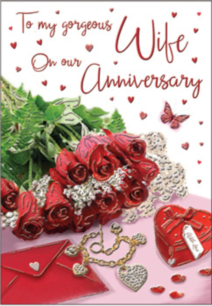 An intimate anniversary tableau stretches across this card design, evoking the thoughtful calm of a late-night celebration in Manor House after the city noise has softened. At its heart lies a compact bouquet of red roses, their petals richly curled and layered so that the blooms have a sculpted, almost velvety appearance. Each rose is a deep crimson, the colour associated with true and lasting affection, and they are cradled by soft green ferns that offer gentle contrast and a feeling of freshness, as though the flowers had just been arranged in a nearby florist's studio off Green Lanes. Scattered around the bouquet is a constellation of tiny hearts and elegant decorative gems, their subtle shimmer catching the light like reflections from distant windows in North London's evening glow. A striking scarlet jewellery box, tied neatly with ribbon, sits in the composition, its shape solid and reassuring, suggesting a treasured ring or necklace kept safe inside. Beside it lies a delicate golden necklace shaped into intertwined hearts, the loops crossing and embracing one another, an unmistakable symbol of unity and devotion. The background of the card carries graceful scripted text, letters gently sweeping across the surface, reminiscent of personal vows or lines from a favourite love note shared years ago. Floating around this script are miniature red hearts that seem to drift down like soft confetti after a quiet toast at home. Soft, enveloping lighting bathes the entire arrangement, highlighting the rich red petals and the warm metallic glints, while leaving just enough shadow to create depth and intimacy. The overall effect feels like a heartfelt tribute crafted by a local Manor House florist who understands how couples here celebrate their anniversaries-with roses, keepsakes, and words that matter more than anything else.